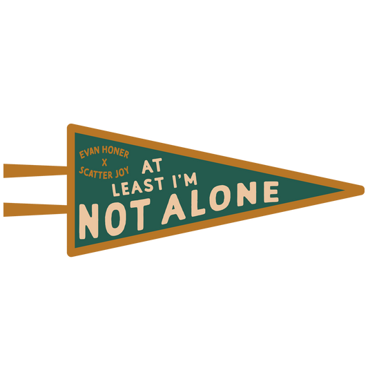 Pennant-style sign with text 'At Least I'm Not Alone' on a white background